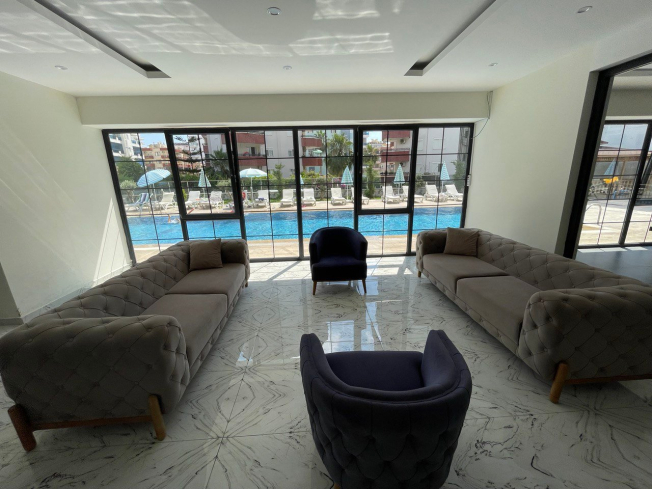 1+1 apartment for sale with mountain view in the center of the popular area of Alanya - Mahmutlar