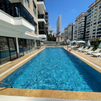 1+1 apartment for sale with mountain view in the center of the popular area of Alanya - Mahmutlar