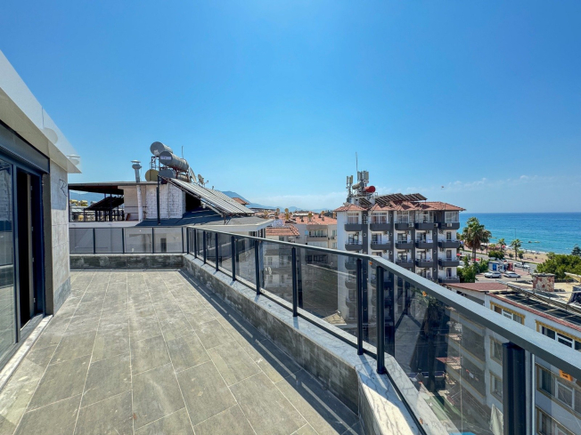 Spacious 4+1 penthouse in a brand-new building  just 50 meters from the sandy beach in the prestigious Oba area