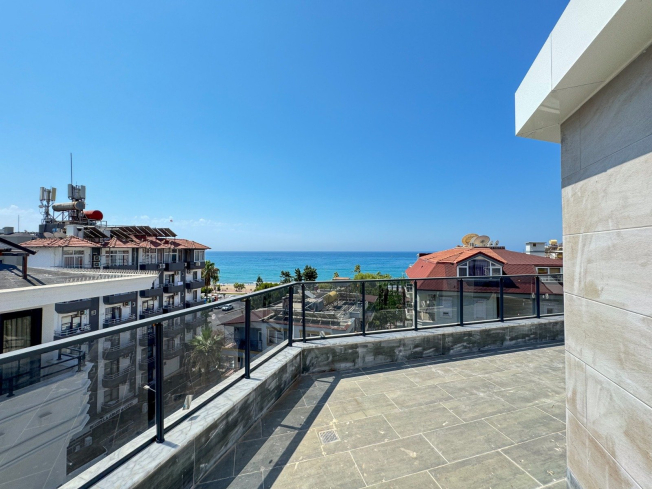 Spacious 4+1 penthouse in a brand-new building  just 50 meters from the sandy beach in the prestigious Oba area