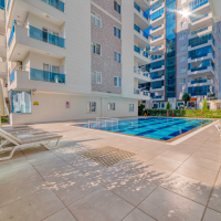 Cozy Furnished 1+1 Apartment in Mahmutlar with Mountain View and Full Facilities