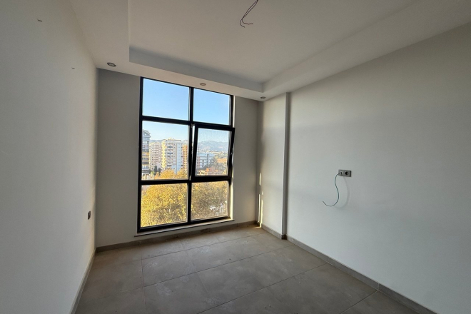 Modern 1+1 Apartment with Sea and Mountain Views in Mahmutlar at a Great Price