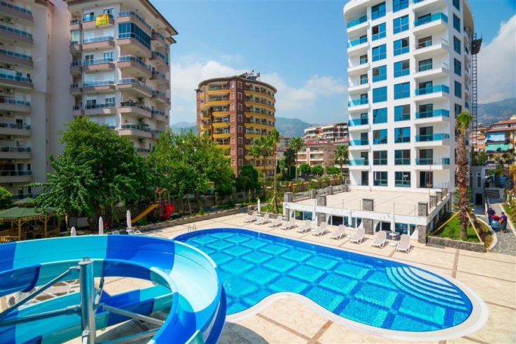Fully furnished 1+1 in Alanya center — residence permit eligible, 600 m from the sea