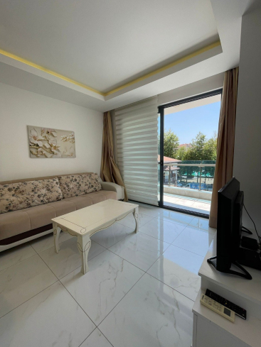 Fully furnished 1+1 in Alanya center — residence permit eligible, 600 m from the sea