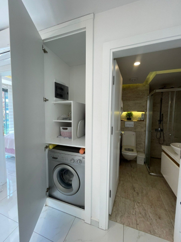 Fully furnished 1+1 in Alanya center — residence permit eligible, 600 m from the sea