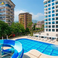 Fully furnished 1+1 in Alanya center — residence permit eligible, 600 m from the sea