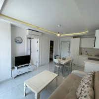 Fully furnished 1+1 in Alanya center — residence permit eligible, 600 m from the sea