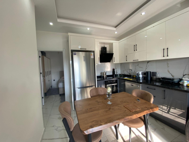 Modern 2+1 Apartment with Private Garden and Direct Pool Access in Demirtaş