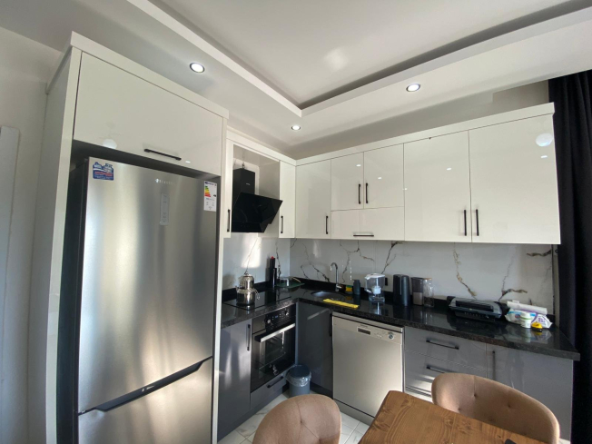 Modern 2+1 Apartment with Private Garden and Direct Pool Access in Demirtaş