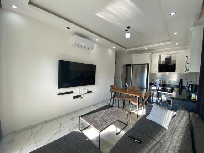 Modern 2+1 Apartment with Private Garden and Direct Pool Access in Demirtaş