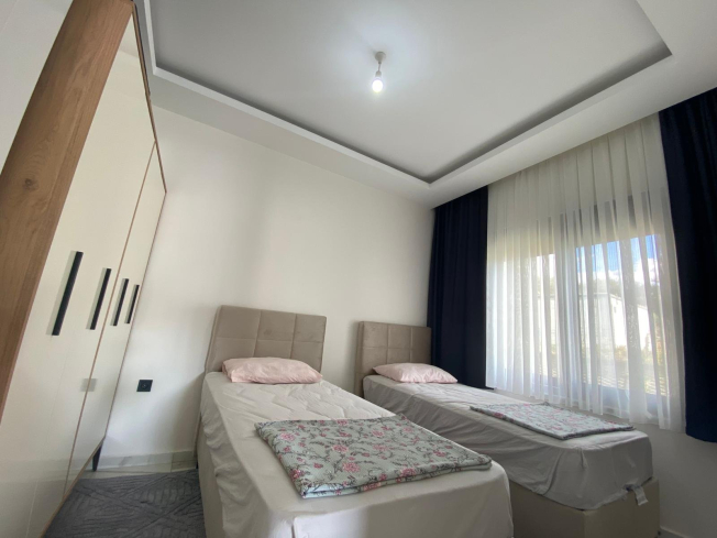 Modern 2+1 Apartment with Private Garden and Direct Pool Access in Demirtaş