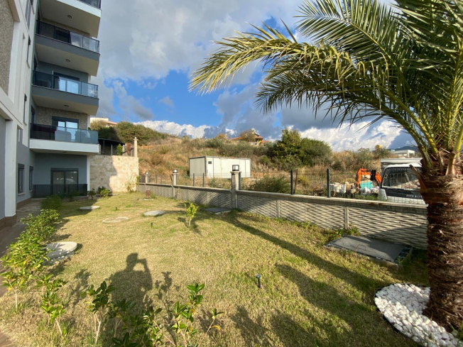 Modern 2+1 Apartment with Private Garden and Direct Pool Access in Demirtaş