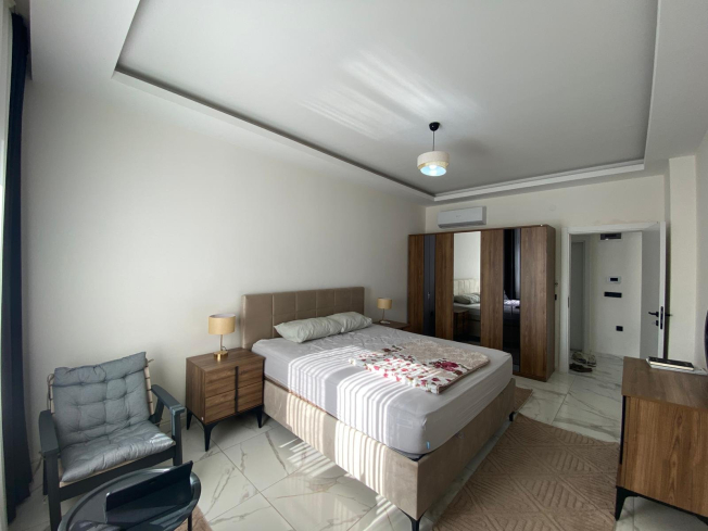 Modern 2+1 Apartment with Private Garden and Direct Pool Access in Demirtaş