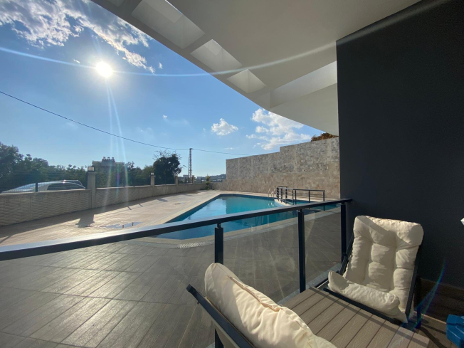 Modern 2+1 Apartment with Private Garden and Direct Pool Access in Demirtaş