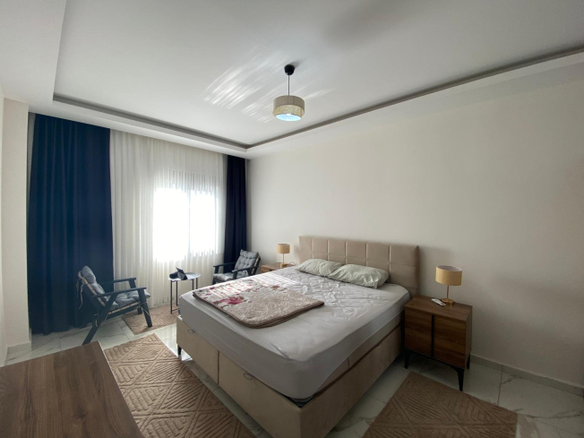 Modern 2+1 Apartment with Private Garden and Direct Pool Access in Demirtaş