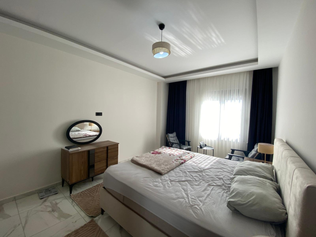 Modern 2+1 Apartment with Private Garden and Direct Pool Access in Demirtaş