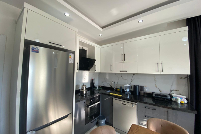 Modern 2+1 Apartment with Private Garden and Direct Pool Access in Demirtaş