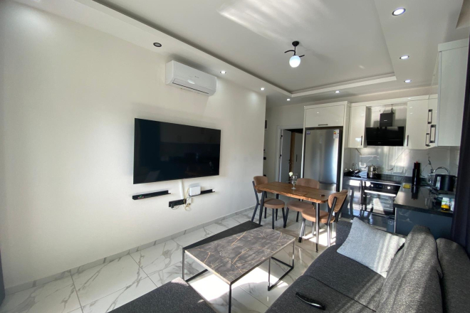 Modern 2+1 Apartment with Private Garden and Direct Pool Access in Demirtaş