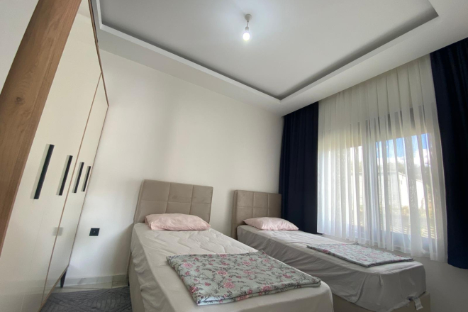 Modern 2+1 Apartment with Private Garden and Direct Pool Access in Demirtaş