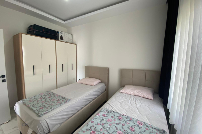 Modern 2+1 Apartment with Private Garden and Direct Pool Access in Demirtaş