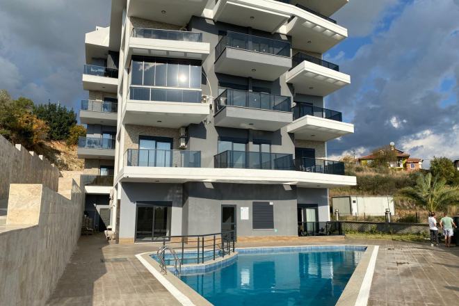 Modern 2+1 Apartment with Private Garden and Direct Pool Access in Demirtaş