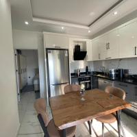 Modern 2+1 Apartment with Private Garden and Direct Pool Access in Demirtaş