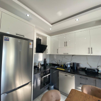 Modern 2+1 Apartment with Private Garden and Direct Pool Access in Demirtaş