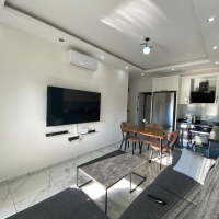 Modern 2+1 Apartment with Private Garden and Direct Pool Access in Demirtaş