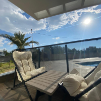 Modern 2+1 Apartment with Private Garden and Direct Pool Access in Demirtaş