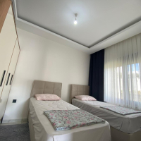 Modern 2+1 Apartment with Private Garden and Direct Pool Access in Demirtaş