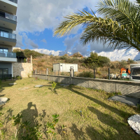 Modern 2+1 Apartment with Private Garden and Direct Pool Access in Demirtaş