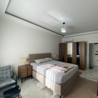 Modern 2+1 Apartment with Private Garden and Direct Pool Access in Demirtaş