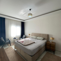 Modern 2+1 Apartment with Private Garden and Direct Pool Access in Demirtaş