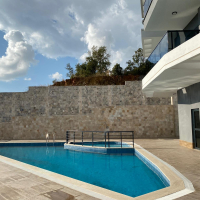 Modern 2+1 Apartment with Private Garden and Direct Pool Access in Demirtaş