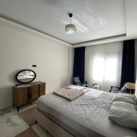 Modern 2+1 Apartment with Private Garden and Direct Pool Access in Demirtaş