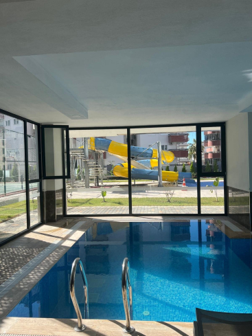 Modern 1+1 Apartment in Mahmutlar with Resort-Style Facilities, 500 m from the Sea