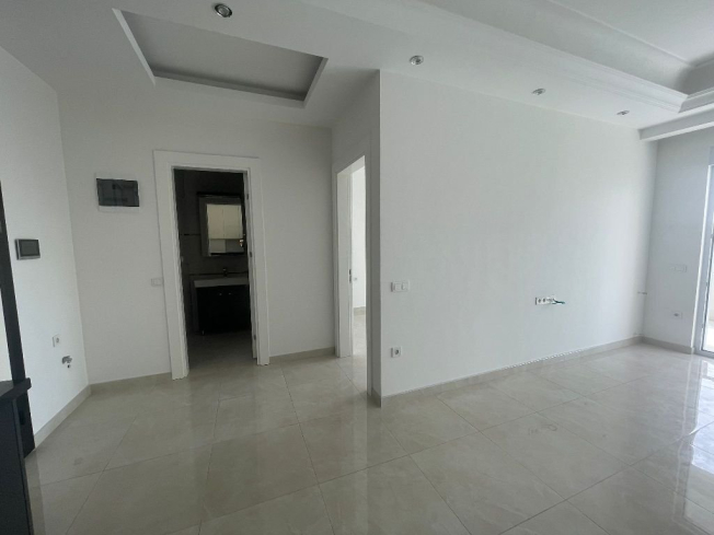 Modern 1+1 Apartment in Mahmutlar with Resort Facilities and Rental Potential