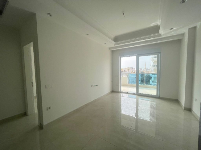 Modern 1+1 Apartment in Mahmutlar with Resort Facilities and Rental Potential