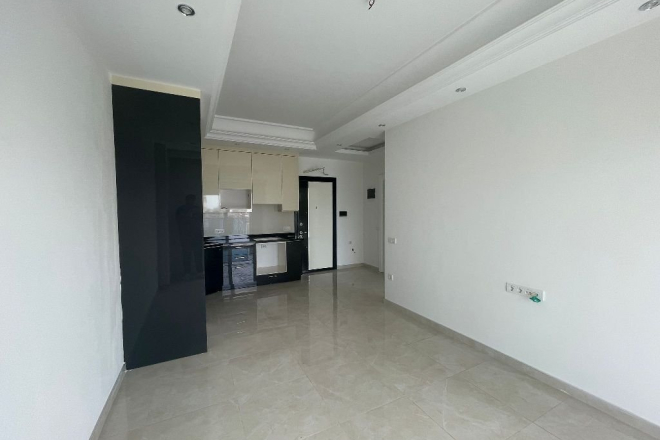 Modern 1+1 Apartment in Mahmutlar with Resort Facilities and Rental Potential