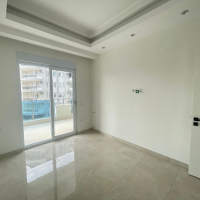 Modern 1+1 Apartment in Mahmutlar with Resort Facilities and Rental Potential