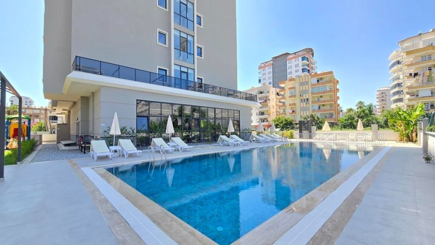 New 1+1 apartment in Mahmutlar with installment plan near the sea
