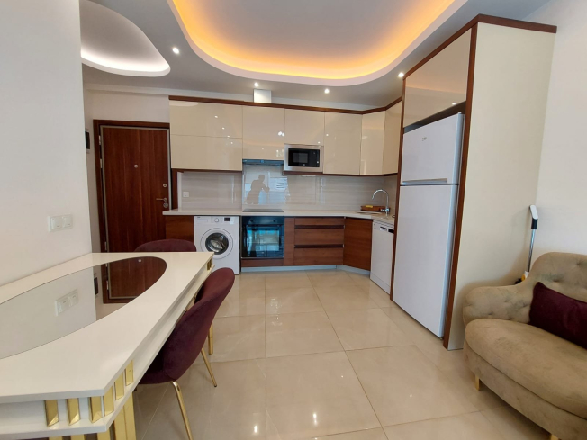 Modern Apartment in Mahmutlar with Resort Facilities and Rental Opportunity