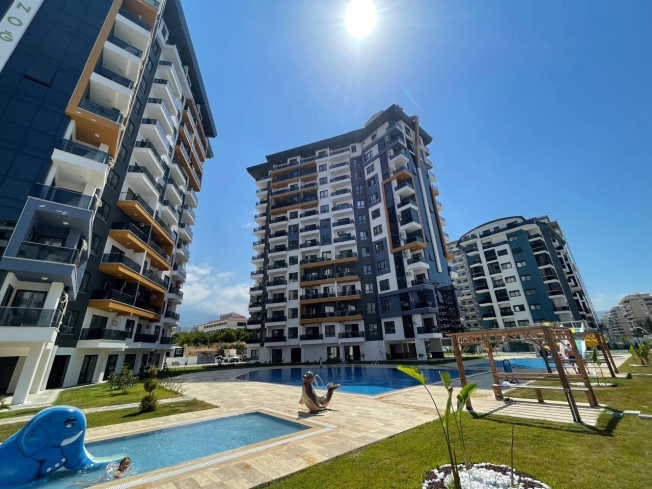 New 1+1 apartment in Mahmutlar with full on-site facilities