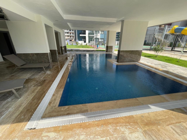 New 1+1 apartment in Mahmutlar with full on-site facilities