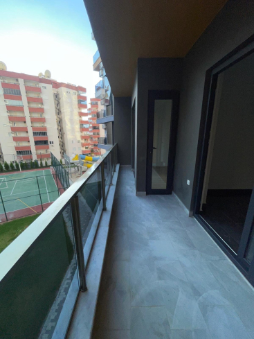 New 1+1 apartment in Mahmutlar with full on-site facilities
