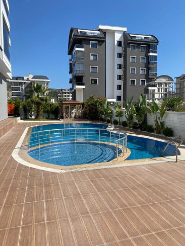 Modern 1+1 apartment in Kargicak — new residence with pool close to the sea