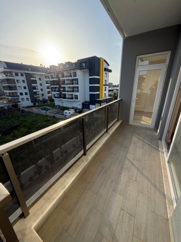 Modern 1+1 apartment in Kargicak — new residence with pool close to the sea