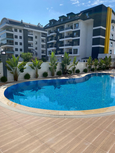 Modern 1+1 apartment in Kargicak — new residence with pool close to the sea