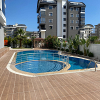 Modern 1+1 apartment in Kargicak — new residence with pool close to the sea