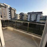Modern 1+1 apartment in Kargicak — new residence with pool close to the sea